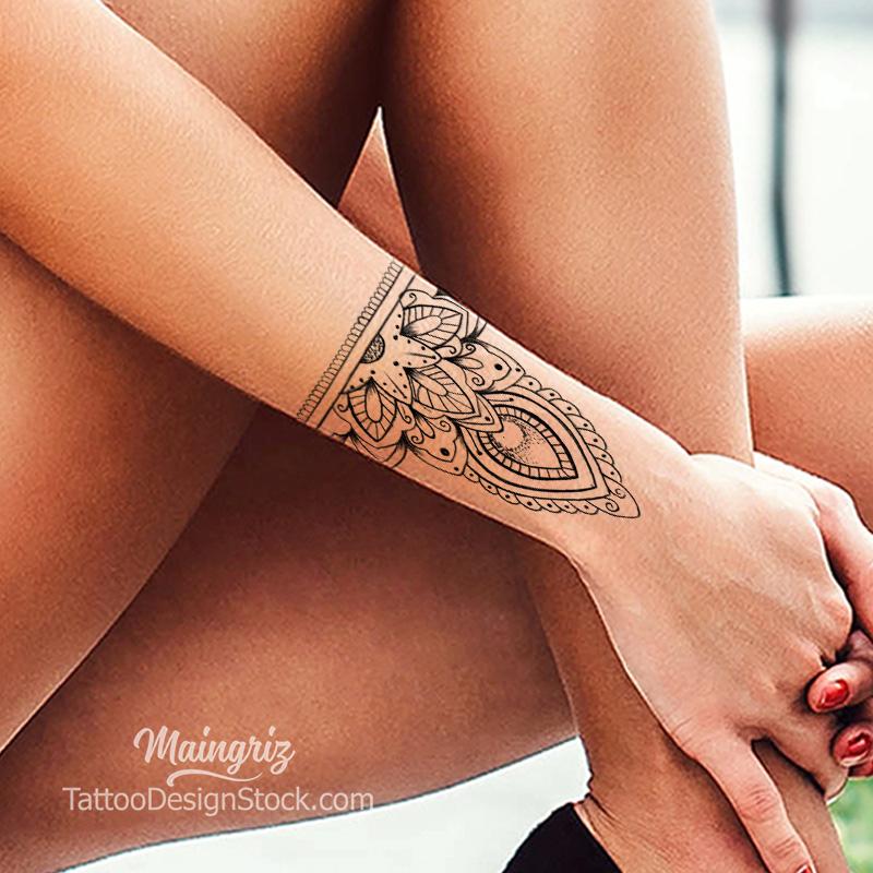 traditional mandala forearm tattoo